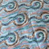 Color: Light Blue/Green-Orange-Black Spiral Lines